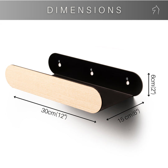 Capsule-shaped wall-mounted rack with a black backplate and a light wood front, showing dimensions: 30 cm (12 inches) wide, 15 cm (6 inches) deep, and 6 cm (2 inches) tall.